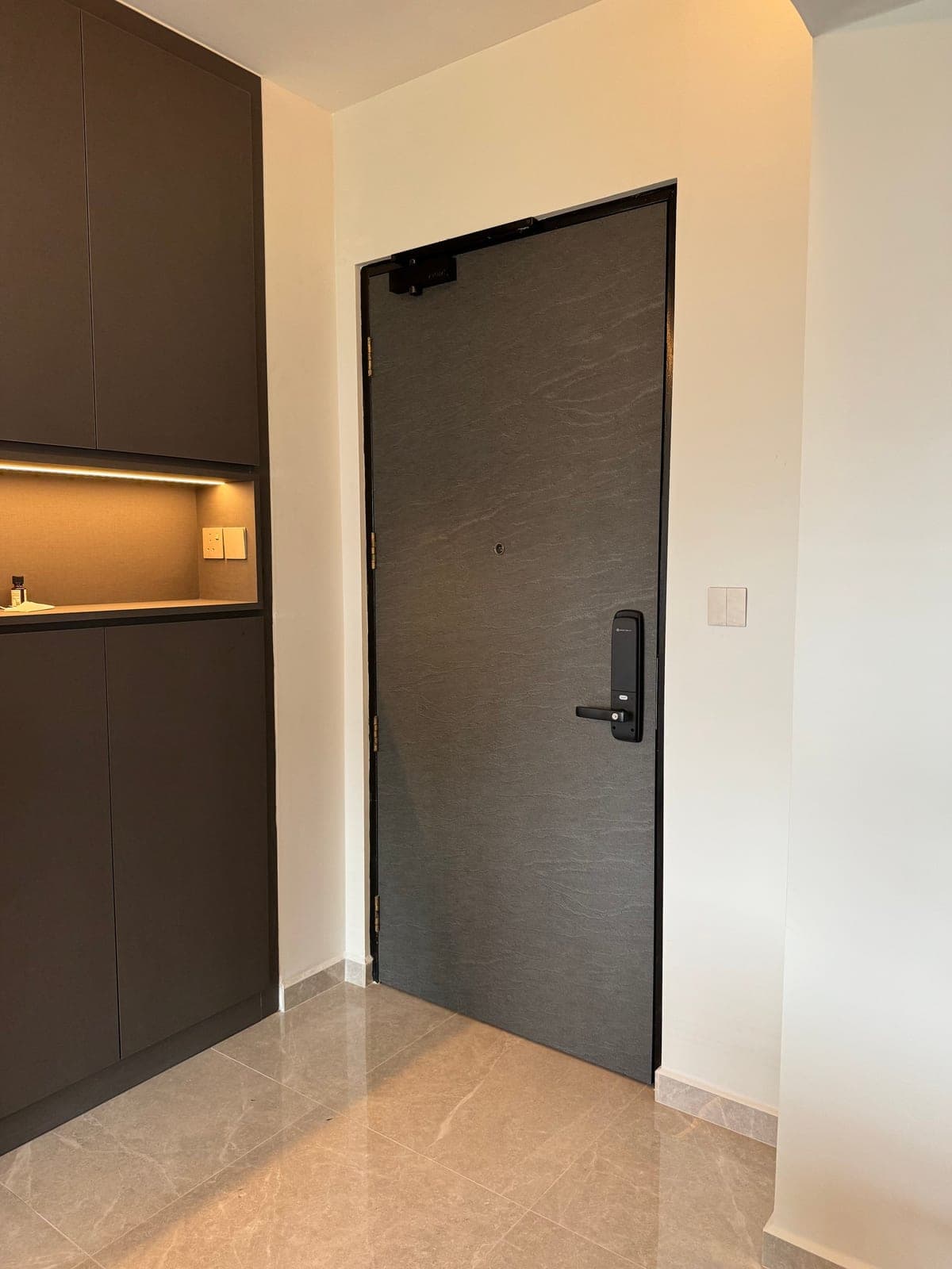 The main door wrapped in a slate-look film